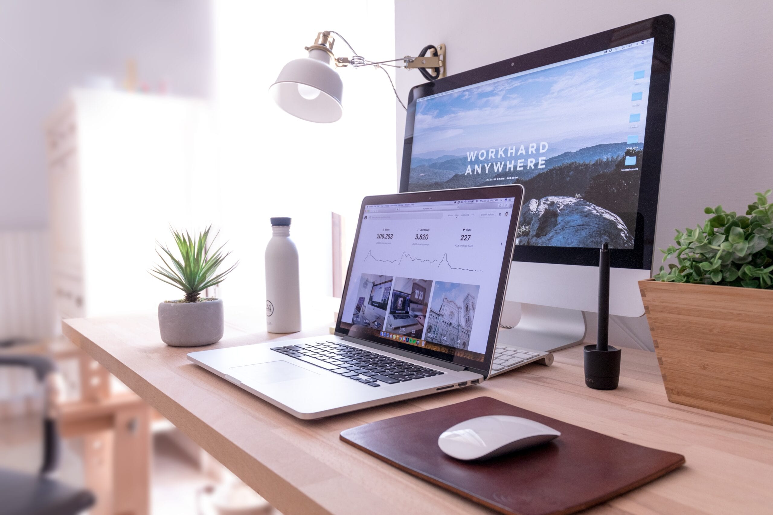 Successful business team together in office lobby website on desktop and laptop
